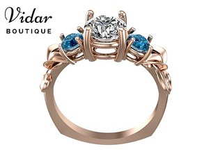 3 Stone Rose Gold Engagement Ring With Blue Diamonds